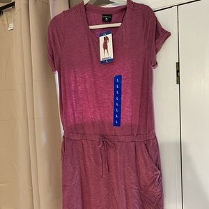 Large tee shirt dress. NWT. Above knee length on a 5’5” height.